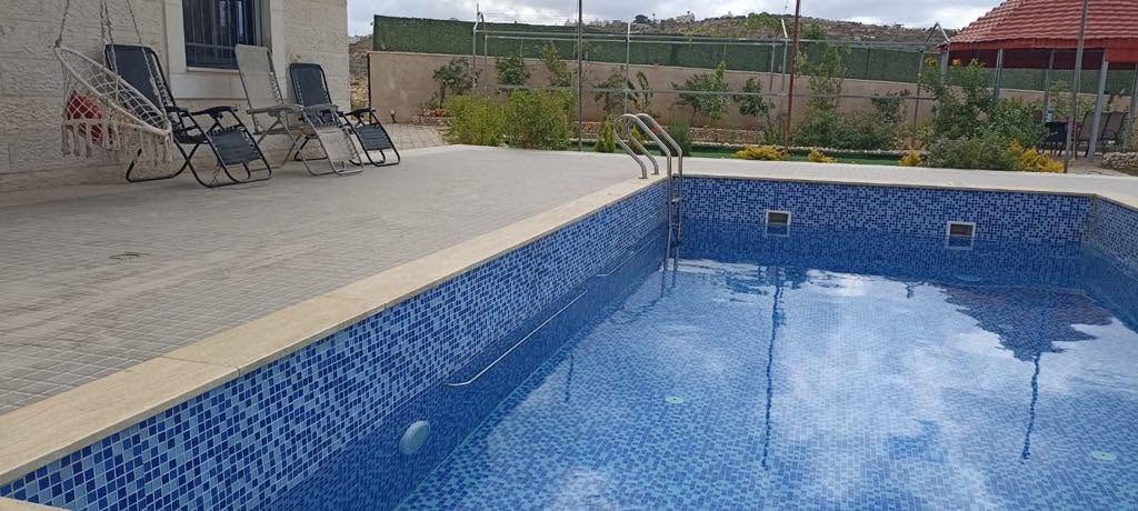 Photo of the completed pool and terrace